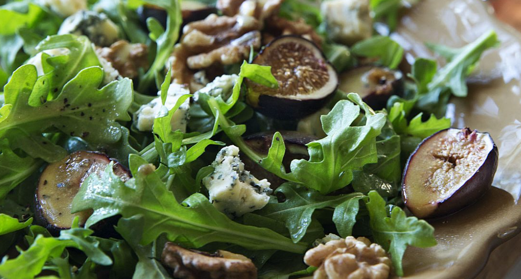 Warm Fig & Arugula Salad close up photo with blue cheese on the salad from the barefoot contessa