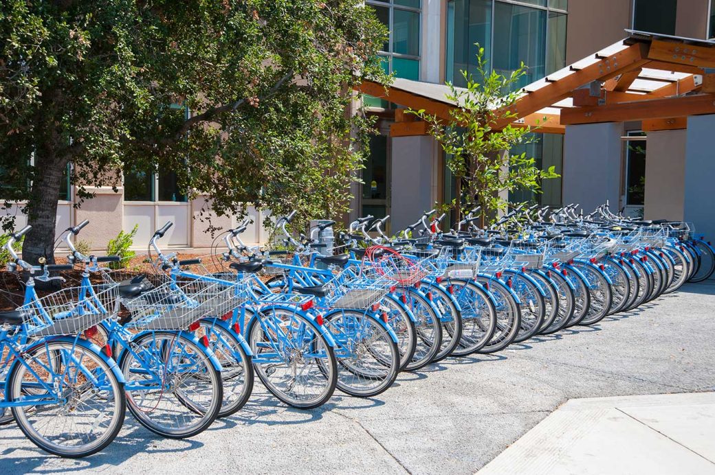 Google also has offices in menlo park. here are there are a bunch of light blue bikes with baskets.